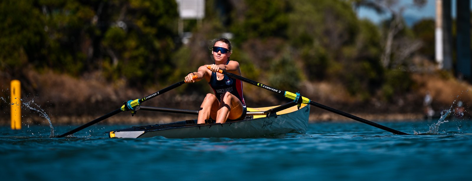 Alia Marquardt rowing a coastal solo head-on at the turn buoy