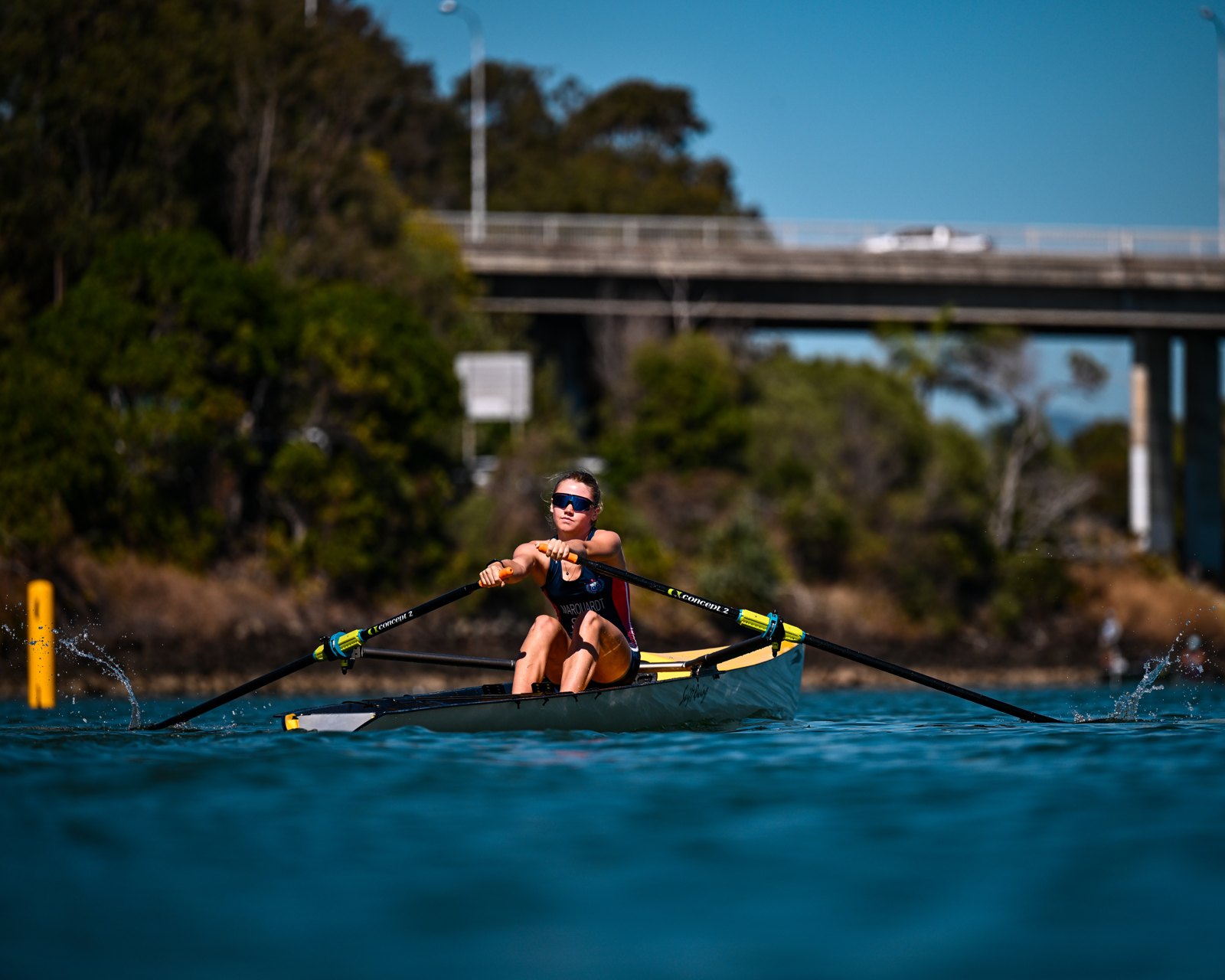 Alia Marquardt rowing a coastal solo head-on towards the camera at the turn buoy on Currumbin Creek